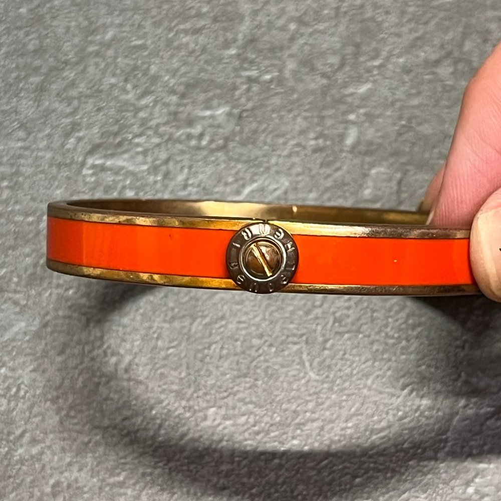 Henri Bendel Clasp Close Orange and Gold Bangle Bracelet
